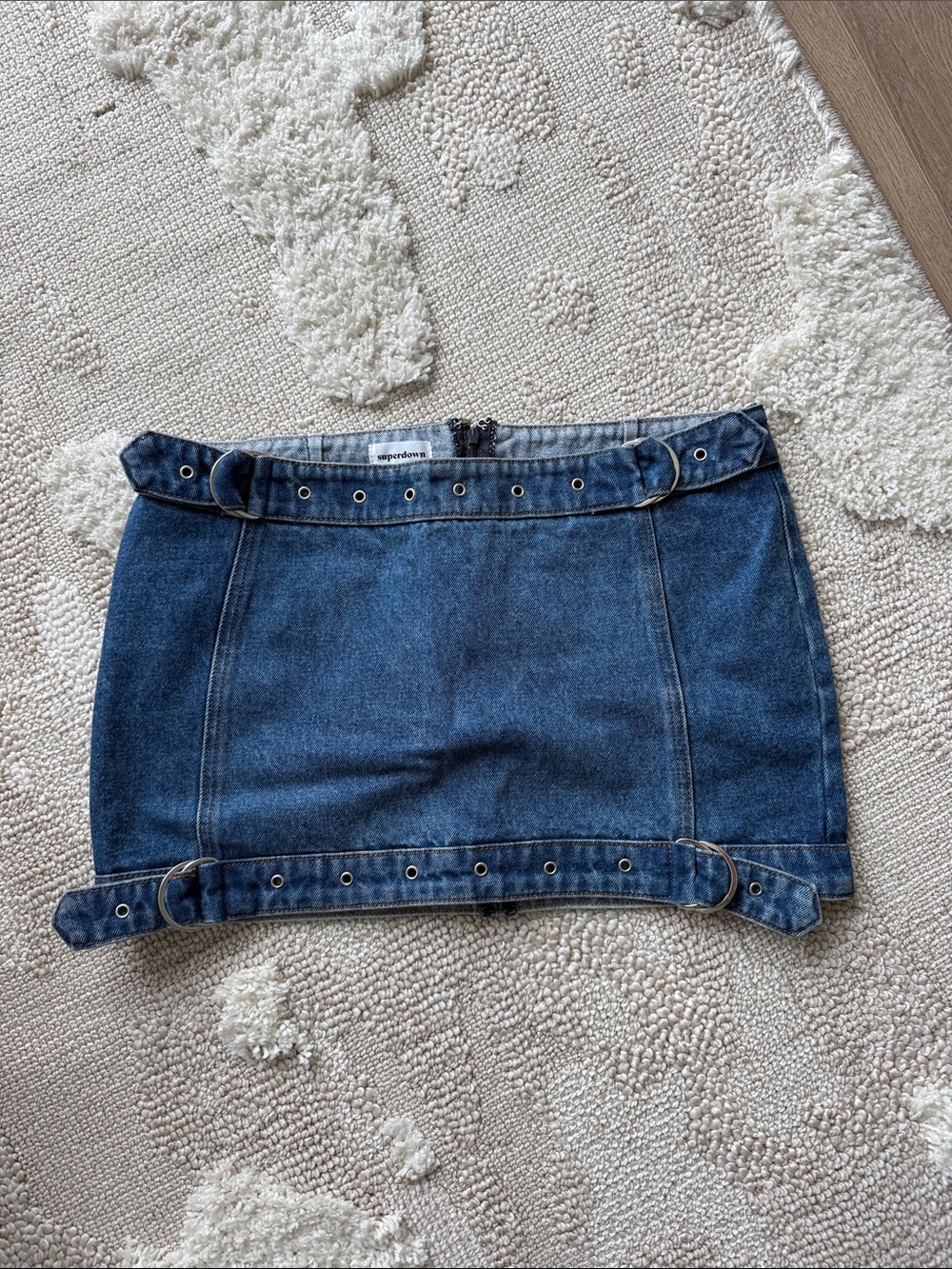REVOLVE Dark Blue Denim Mini Skirt with Grommet Belt Accents